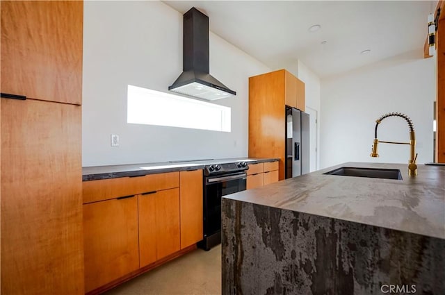 kitchen featuring a center island, wall chimney range hood, sink, stainless steel fridge with ice dispenser, and electric range