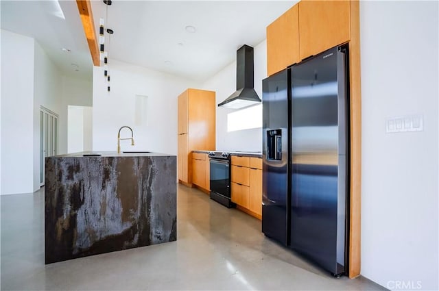 kitchen with wall chimney exhaust hood, light brown cabinets, sink, stainless steel fridge, and black electric range