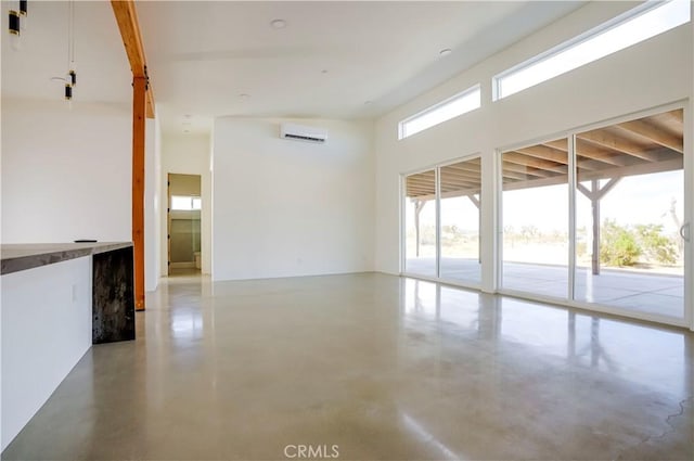 spare room featuring a wall mounted AC