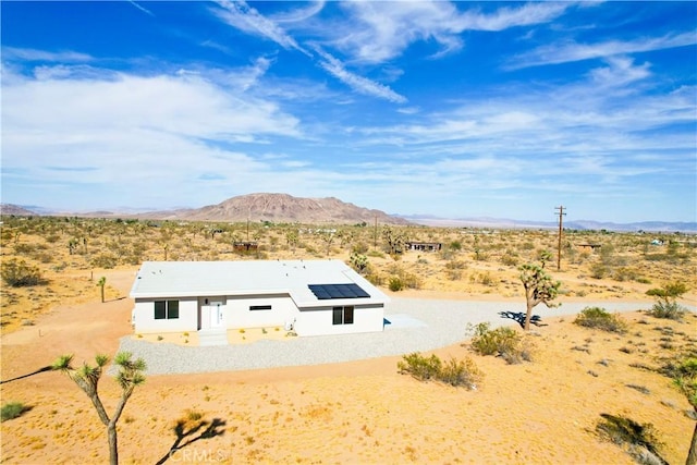 entry to storm shelter with a mountain view