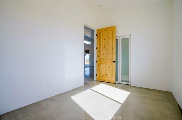 empty room featuring a high ceiling