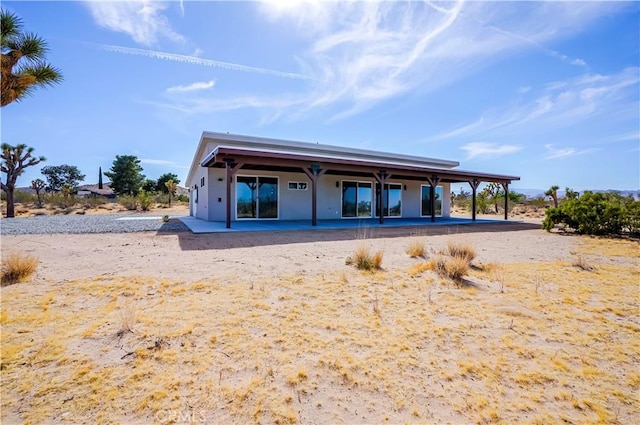 rear view of house with a patio area