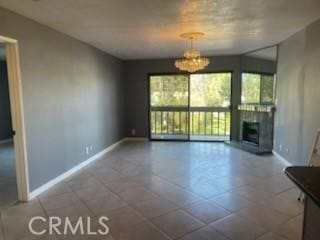 unfurnished living room with a chandelier