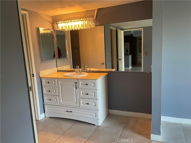 bathroom featuring vanity and tile patterned flooring