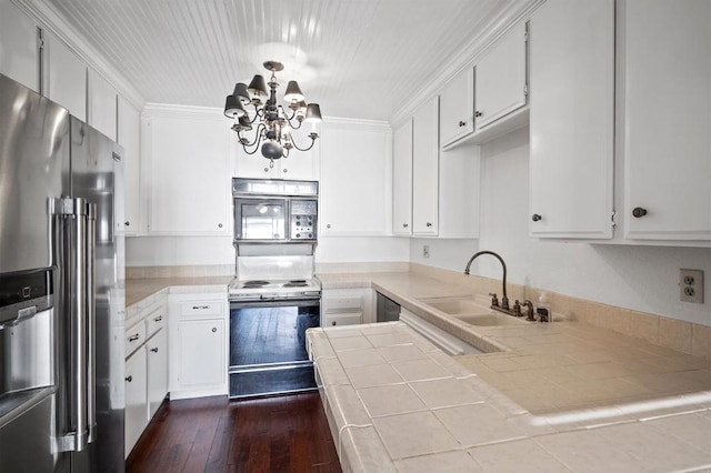 kitchen with electric range, high end fridge, a sink, dark wood-style floors, and tile countertops