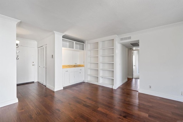 interior space with visible vents, baseboards, dark wood-style flooring, and crown molding