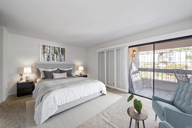 bedroom with access to outside and carpet