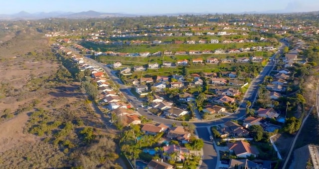 birds eye view of property featuring a mountain view