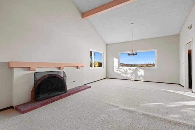 unfurnished living room featuring beam ceiling, carpet floors, high vaulted ceiling, and a textured ceiling