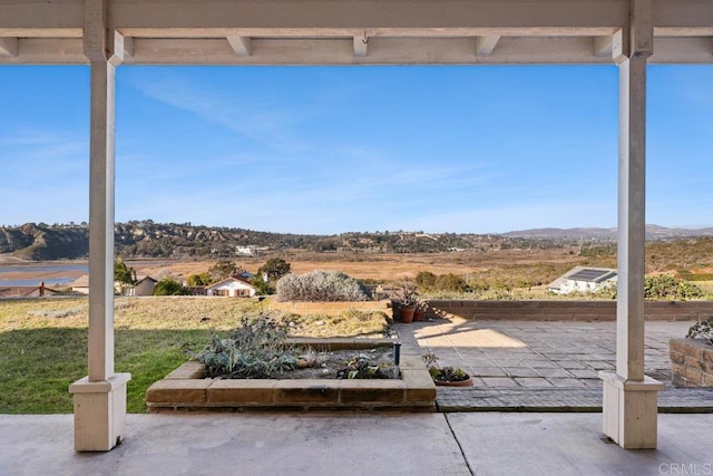 view of patio / terrace with a mountain view