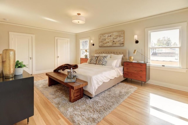 bedroom featuring wood-type flooring and ornamental molding