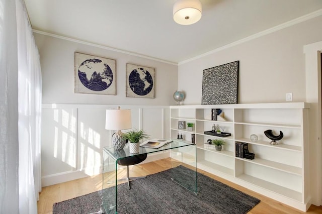 interior space with light hardwood / wood-style floors and ornamental molding