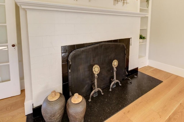 room details featuring hardwood / wood-style floors and built in features