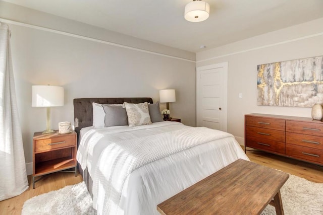 bedroom with light wood-type flooring