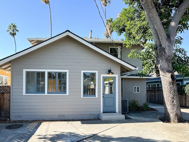 view of front of house featuring central air condition unit and a patio