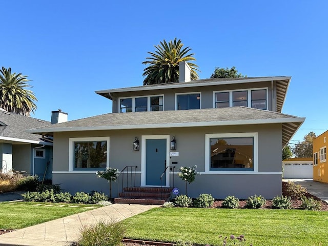 view of front of property with a front lawn