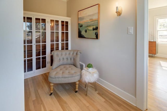 sitting room featuring hardwood / wood-style flooring