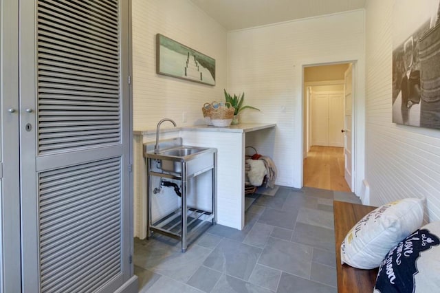 clothes washing area featuring sink