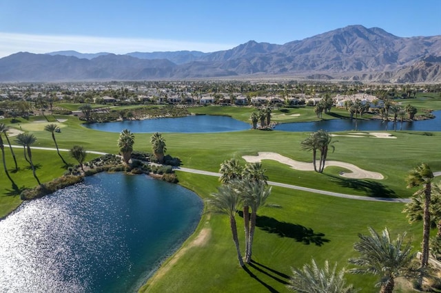 surrounding community with a water and mountain view