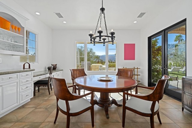 dining space featuring a notable chandelier