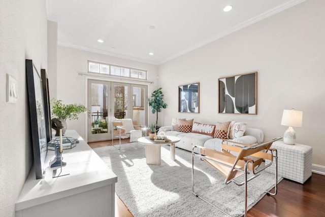 living room featuring crown molding, dark wood-type flooring, and french doors