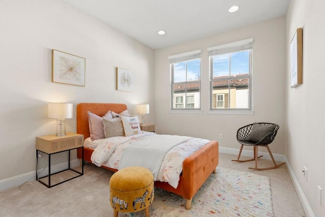 bedroom featuring light carpet