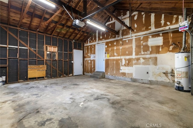 266 E Fig Ln, Corning, CA 96021 - garage with a garage door opener and water heater