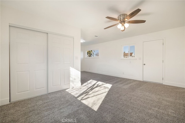 266 E Fig Ln, Corning, CA 96021 - unfurnished bedroom with a closet, dark colored carpet, and ceiling fan