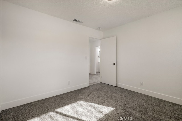 266 E Fig Ln, Corning, CA 96021 - carpeted empty room with a textured ceiling