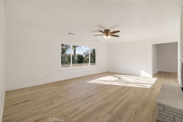 266 E Fig Ln, Corning, CA 96021 - unfurnished room featuring ceiling fan, light hardwood / wood-style floors, and a textured ceiling