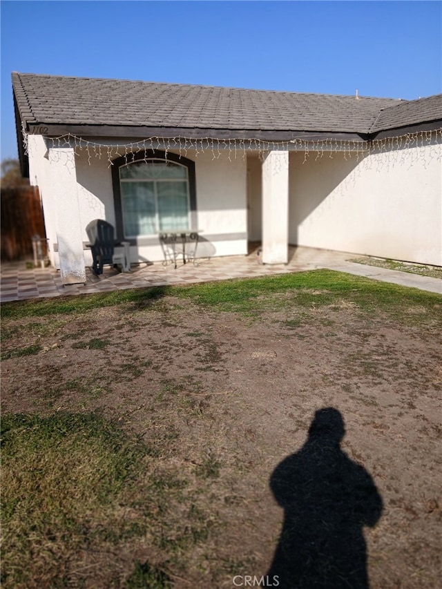 view of side of property featuring a patio