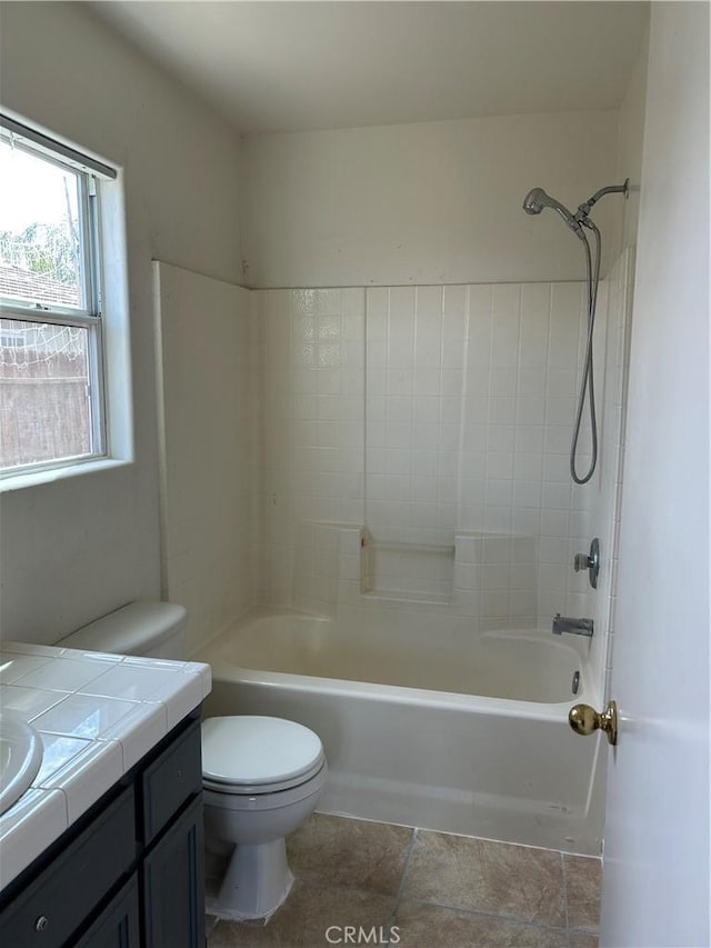 bathroom with bathtub / shower combination, vanity, and toilet