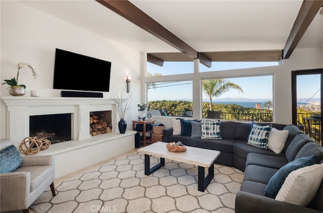 living room with vaulted ceiling with beams