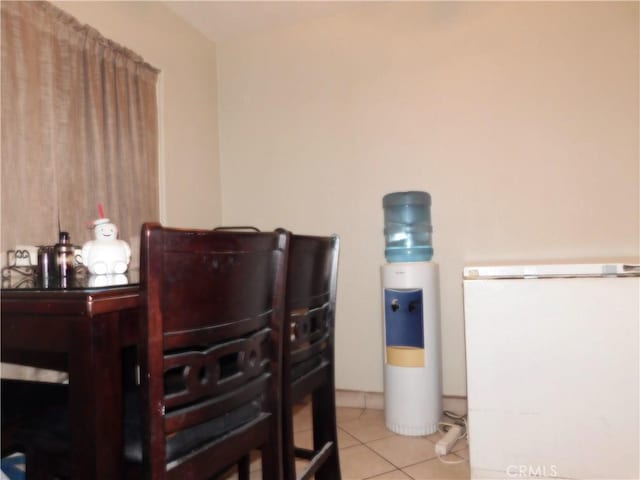 dining area with light tile patterned floors