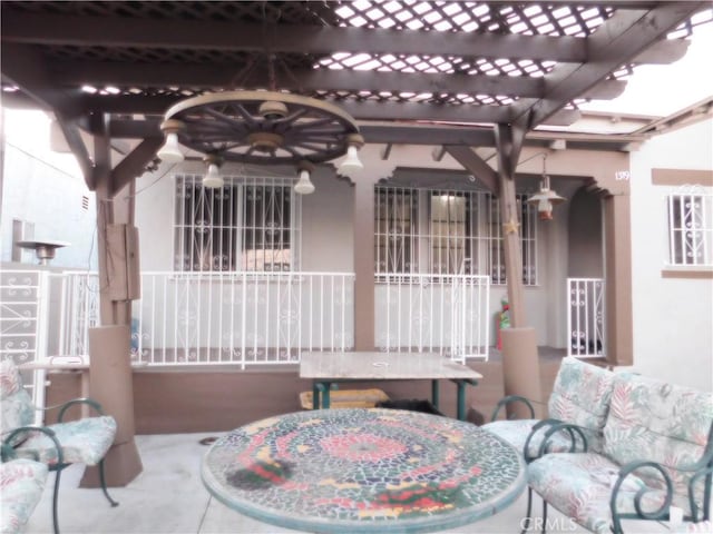 view of patio / terrace featuring ceiling fan