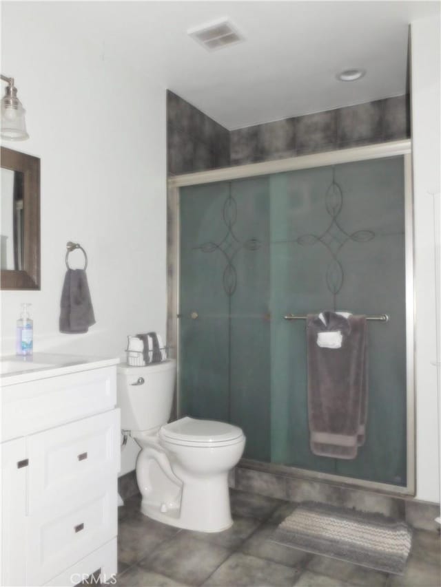 bathroom featuring walk in shower, vanity, and toilet