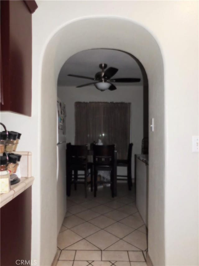 hallway featuring light tile patterned floors