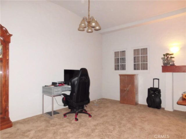 carpeted home office featuring an inviting chandelier