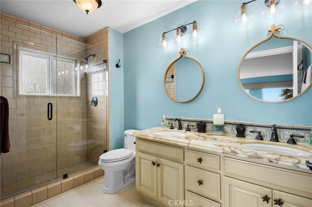 bathroom with tile patterned floors, an enclosed shower, vanity, and toilet