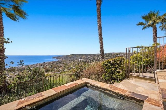 view of patio featuring a water view