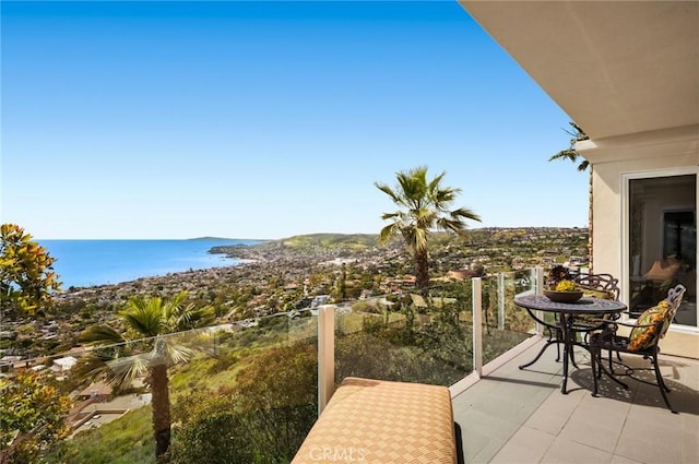 balcony featuring a water view