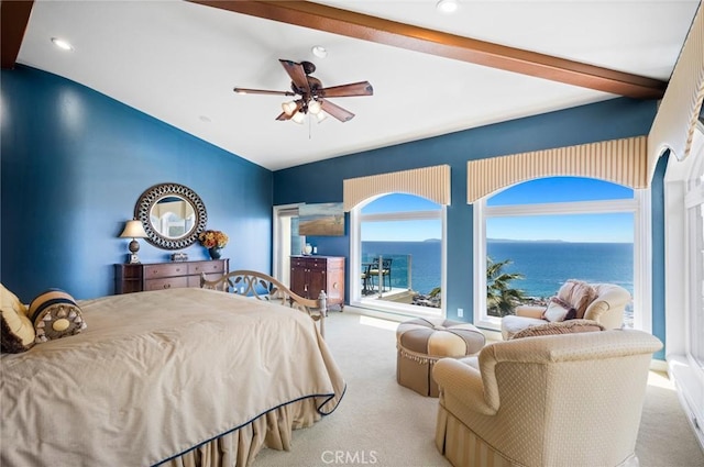 carpeted bedroom with ceiling fan, lofted ceiling with beams, and a water view