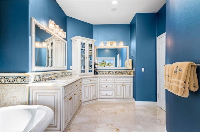 bathroom with vanity and a bathtub