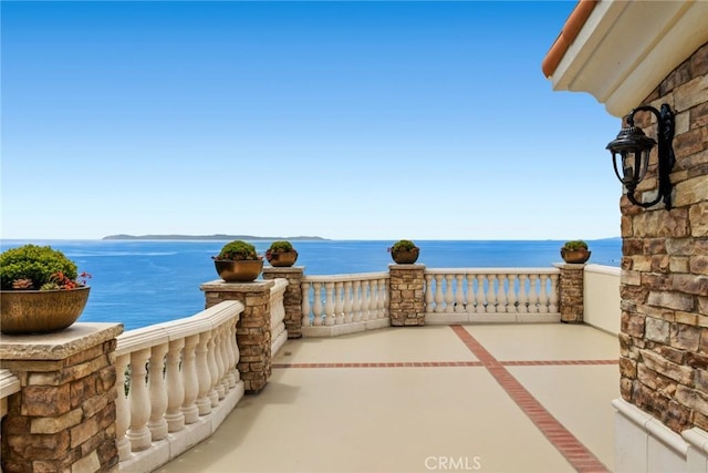 view of patio / terrace featuring a water view