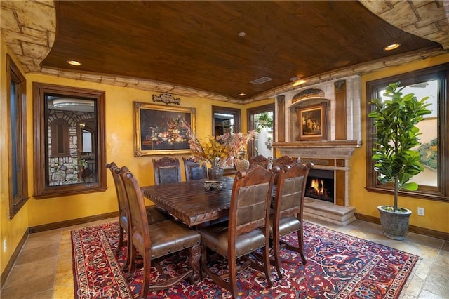 dining area featuring wood ceiling