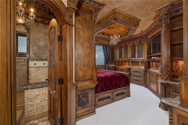 bedroom featuring an inviting chandelier and carpet