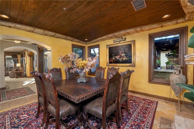 dining space with plenty of natural light and wood ceiling