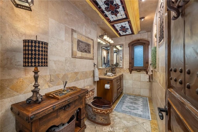 bathroom with tile walls and vanity