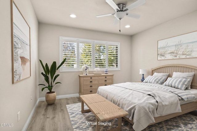 bedroom featuring ceiling fan and light hardwood / wood-style flooring