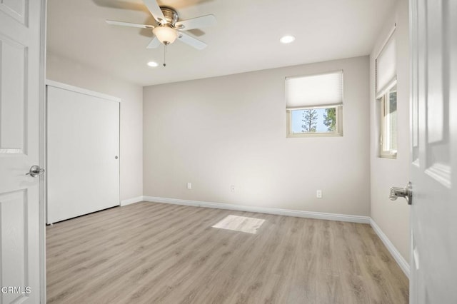 unfurnished bedroom featuring ceiling fan and light hardwood / wood-style flooring